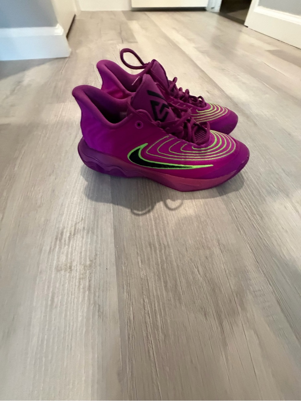 Purple Nike Athletic Shoes with Lime Accent